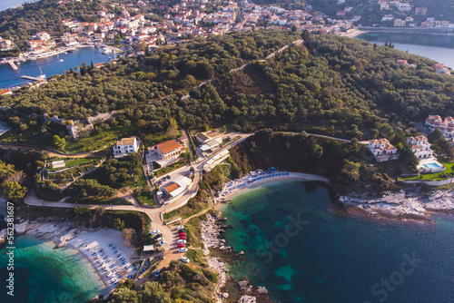 Fototapeta Naklejka Na Ścianę i Meble -  Aerial drone view of Kassiopi, village in northeast coast of Corfu island, Ionian Islands, Kerkyra, Greece in a summer sunny day, with marina, town, beach and castle