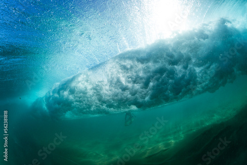 perfect wave breaking underwater in the ocean