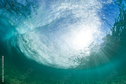 powerful under water wave breaking in the sea