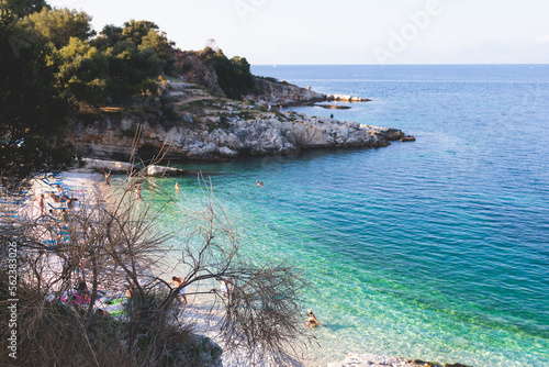 Aerial view of beach in Kassiopi village in northeast coast of Corfu island, Ionian Islands, Kerkyra, Greece in a summer sunny day photo