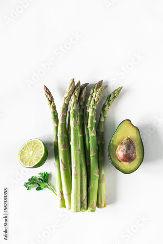 Different fresh green vegetables on a white background. Food delivery. The concept of raw food. Top view