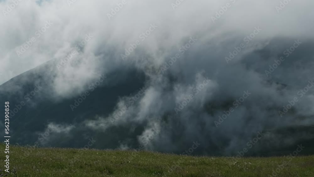 Mountains landscape and fast moving dramatic clouds at dawn, Caucasus, 4k Mountains landscape and fast moving dramatic clouds at dawn, Caucasus, 4k