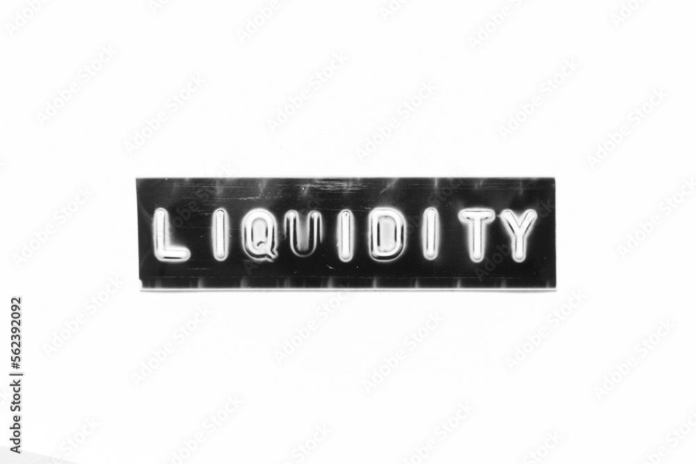 Embossed letter with word liquidity in black banner on white paper background Embossed letter with word liquidity in black banner on white paper background