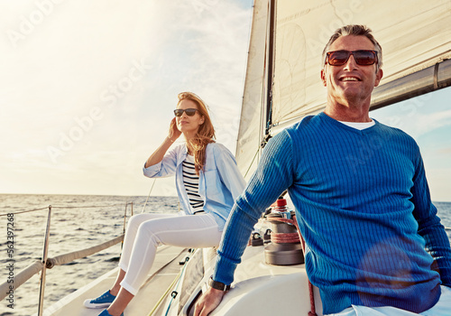 Mature couple, people or sailing yacht bonding on ocean, sea or water in relax holiday, vacation or summer adventure. Smile, happy man or woman on luxury boat in retirement travel location or freedom © Reese/peopleimages.com