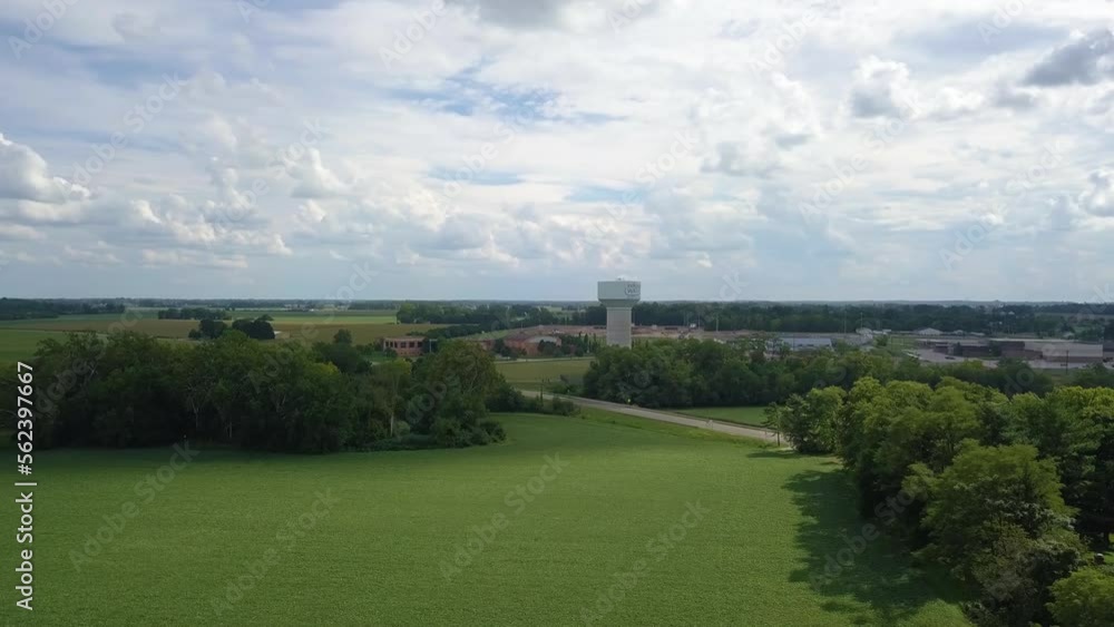 Aerial view orbiting water supply storage tower on Terre Haute rural green farmland, Indiana Aerial view orbiting water supply storage tower on Terre Haute rural green farmland, Indiana