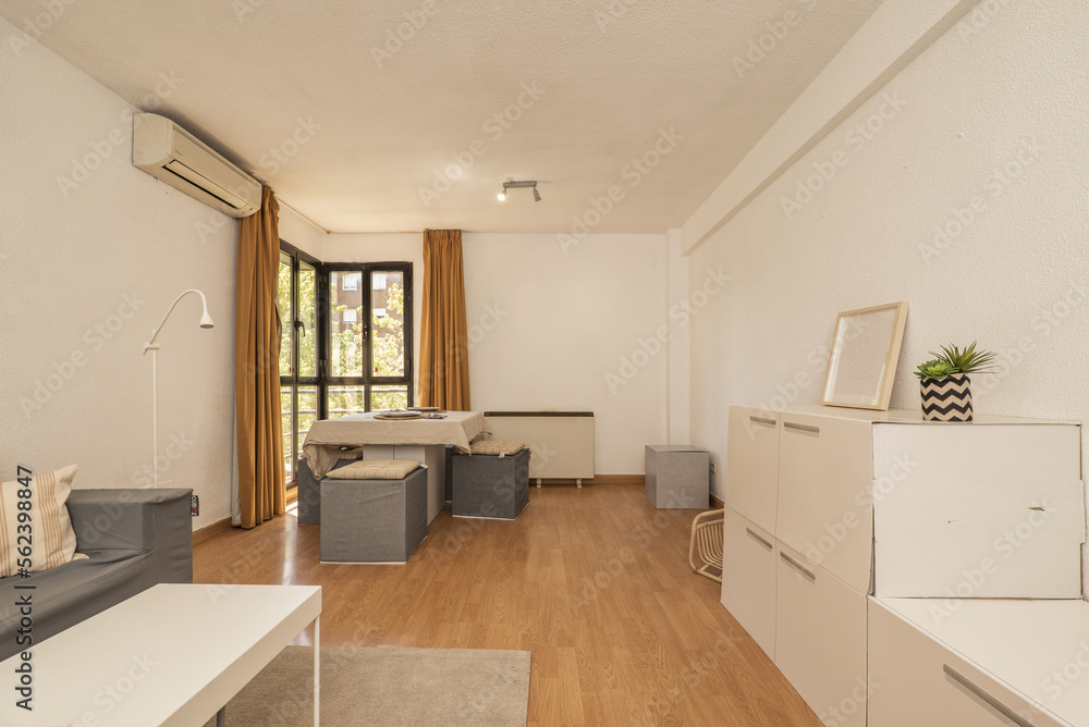 Fototapeta premium Dining room furnished with cardboard furniture and dining table of the same material