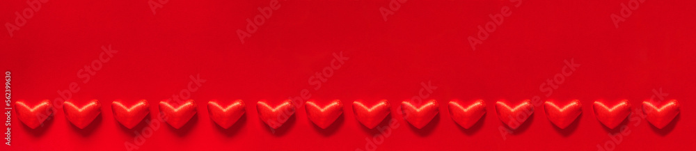 Valentine's day banner with many red hearts on a red background with space for text. love and happiness. Valentine's day banner with many red hearts on a red background with space for text. love and happiness.