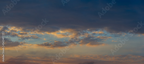 Evening rain clouds against the blue sky. © APHOTOSTUDIO