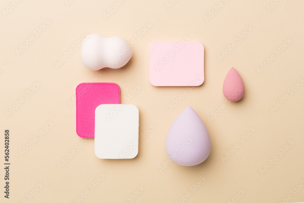 Beauty blenders on color background, top view Beauty blenders on color background, top view