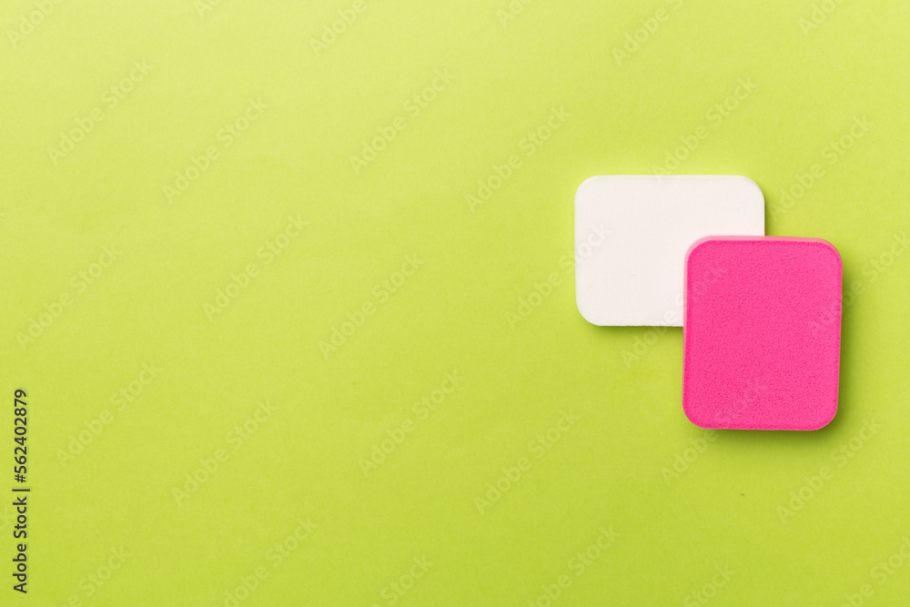 Beauty blenders on color background, top view Beauty blenders on color background, top view