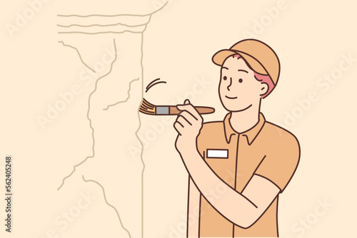 Male archeologist working at excavation site