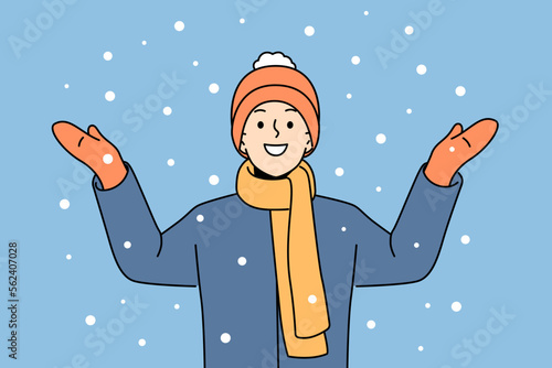 Smiling boy standing outside feel excited with snow. Happy child in outerwear overjoyed with winter holidays. Vector illustration. 