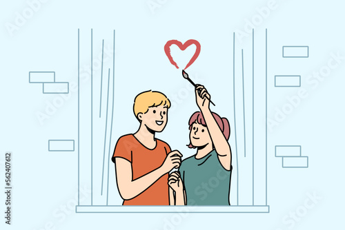 Happy couple drawing heart symbol on window excited about living together. Smiling man and woman show love symbol overjoyed with moving or relocation. Vector illustration. 