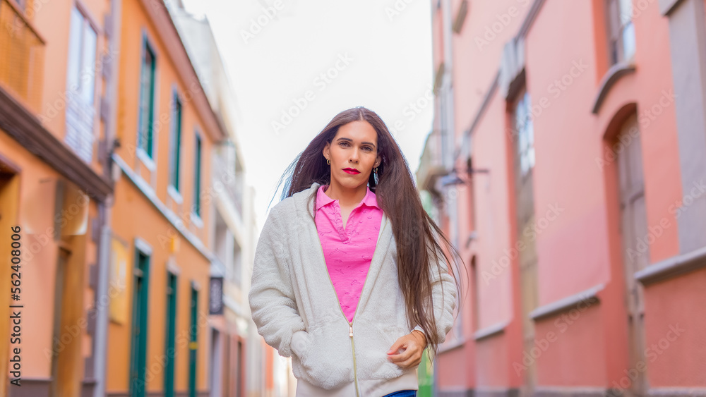 Fototapeta premium Portrait of transgender woman walking through city