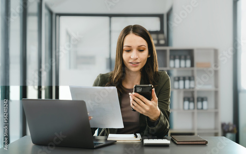 Attractive caucasian business woman top manager working with laptop tablet cojmputer planning financial strategy analyst and global stock market and sector indices trading data.