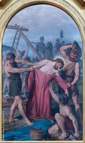VARALLO, ITALY - JULY 17, 2022: The painting Jesus is stripped of His clothes in the church Collegiata di San Gaudenzio by Enrico Reffo from end of 19. cent.