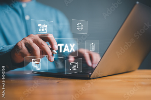 Businesman using computer to complete Individual income tax return form online for tax payment. Government, state taxes. Data analysis, paperwork, financial research, report. Calculation tax return.