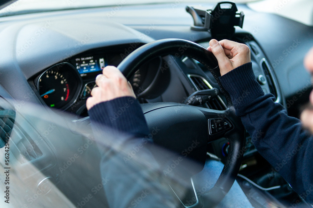 Anonymous male driver sitting in modern car Anonymous male driver sitting in modern car