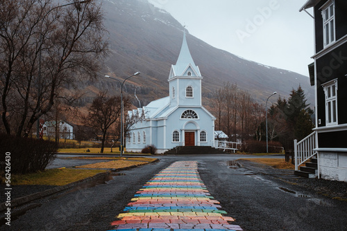Rainbow path leading to church