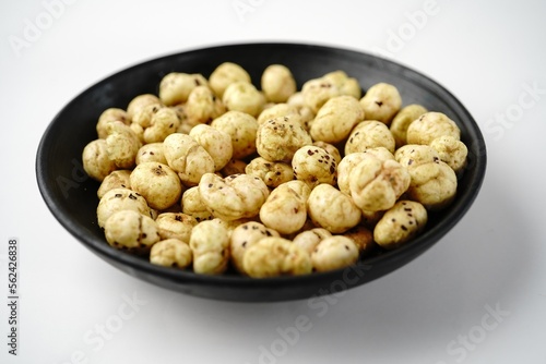 Makhana, also called as Lotus Seeds or Fox Nuts are popular dry snacks from India, served in a bowl.