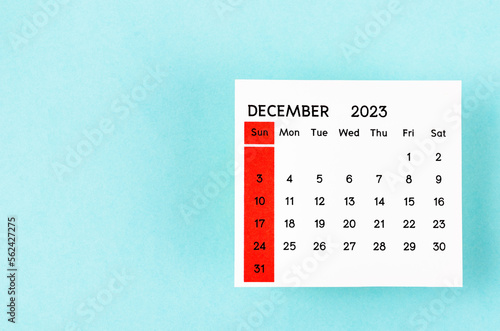 The December 2023 Monthly calendar for 2023 year on blue background.