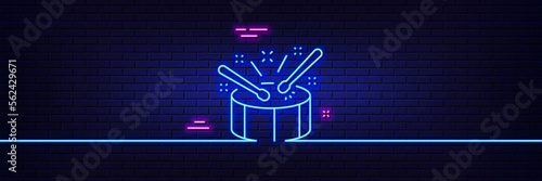 Neon light glow effect. Drums with drumsticks line icon. Music sign. Musical instrument symbol. 3d line neon glow icon. Brick wall banner. Drums outline. Vector