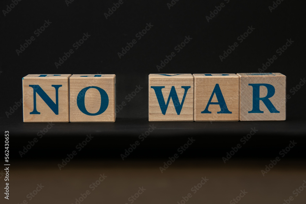 Cubes with the inscription: No to war. Black background.
