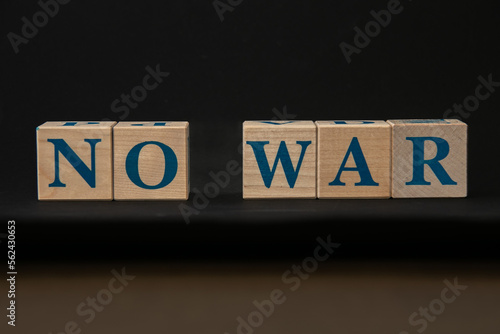 Obraz na płótnie Cubes with the inscription: No to war. Black background. w salonie