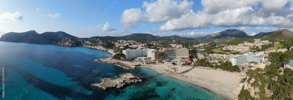 Naklejka premium Panoramic view of Camp de Mar beach in the island of Majorca. Beautiful scene of the seacost with a blue sea and Mediterranean landscape