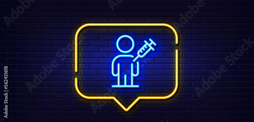 Neon light speech bubble. People vaccination line icon. Vaccine syringe sign. Man jabbed symbol. Neon light background. People vaccination glow line. Brick wall banner. Vector