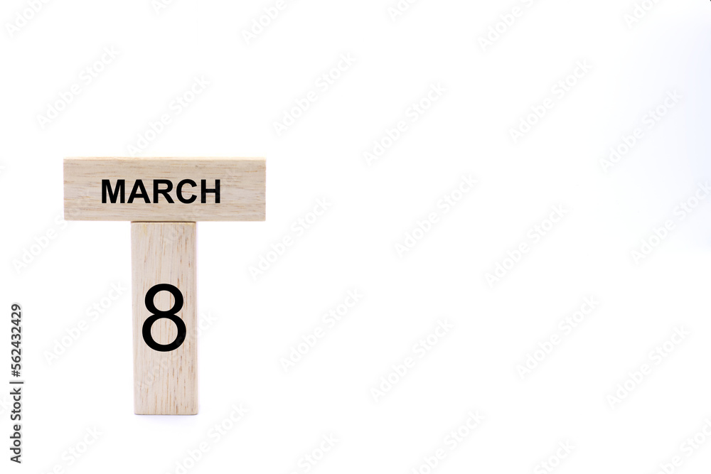 Obraz premium March 8 displayed wooden letter blocks on white background with space for print. Concept for calendar, reminder, date. 