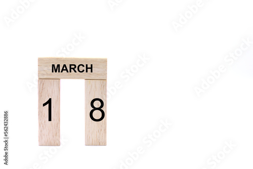 March 18 displayed wooden letter blocks on white background with space for print. Concept for calendar, reminder, date. 