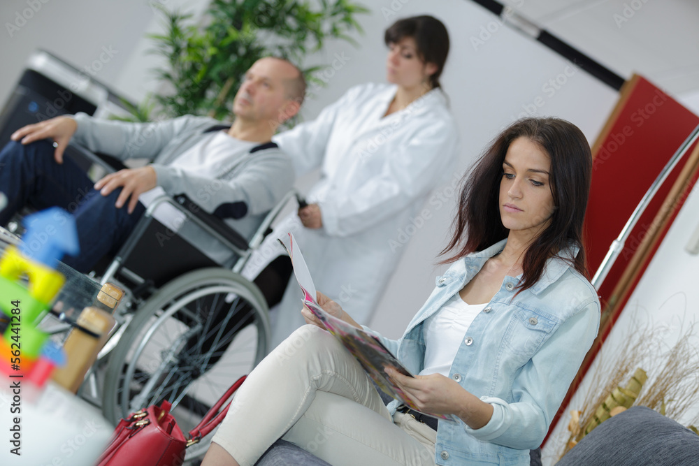 female patientsitting in doctors waiting room female patientsitting in doctors waiting room
