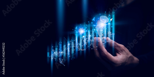 Businessman holding a graph goal of business Investor,analysis economic and calculates financial data and target for long-term investments and profitability in future on digital data system manager..