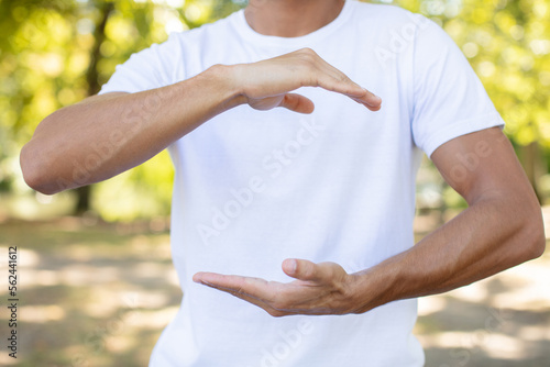 cropped view of hands in tai chi pose photo