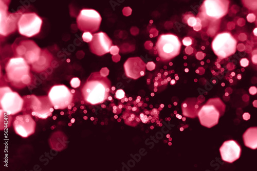Viva magenta blurred abstract bokeh lights background. Snowy shiny glitter sparkle stars for holiday celebrate