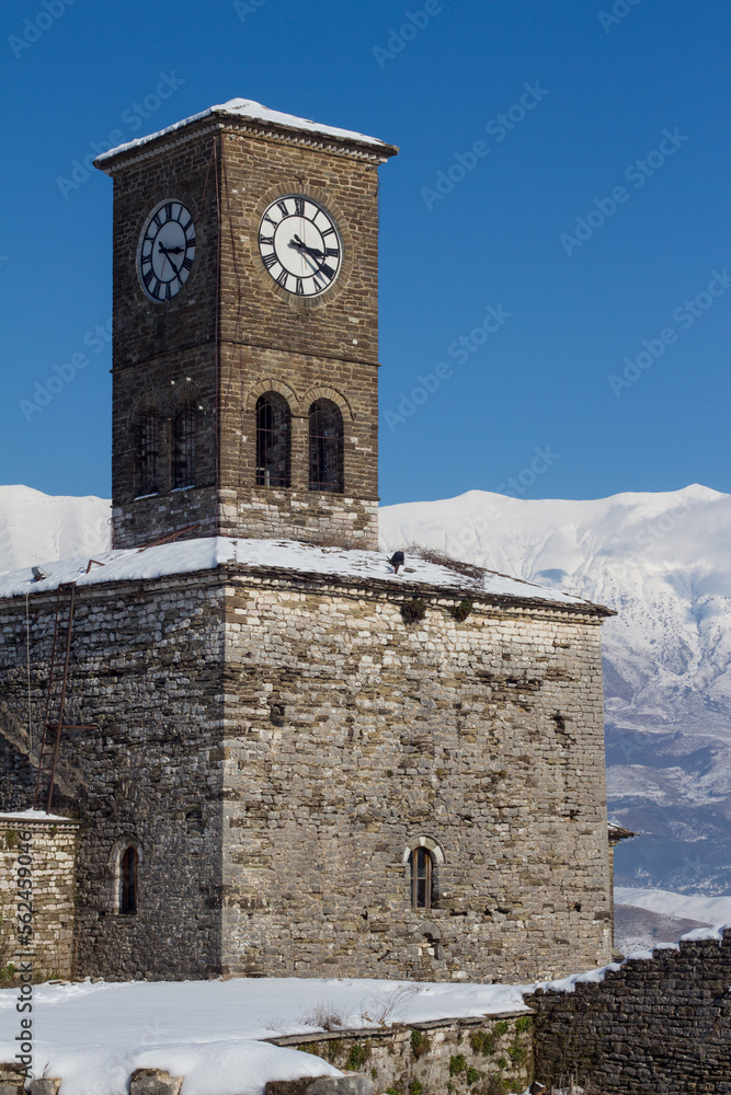 Clock Tower at the Castle of Gjirokaster (Gjirokastër). UNESCO world heritage in Albania. Winter, snow.