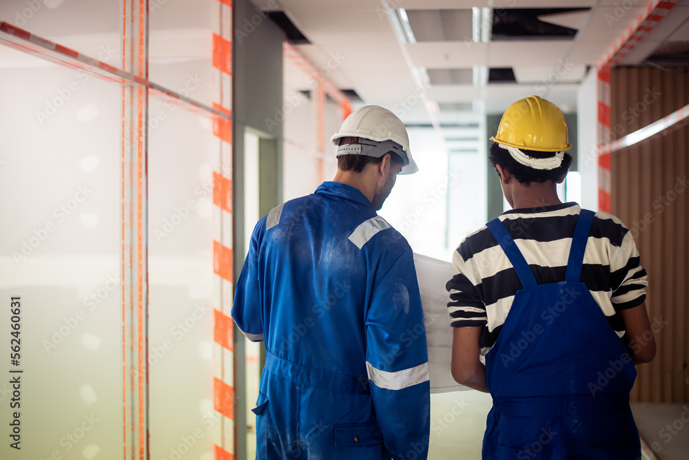 back side of africanamerican civil engineer trainee wearing safety