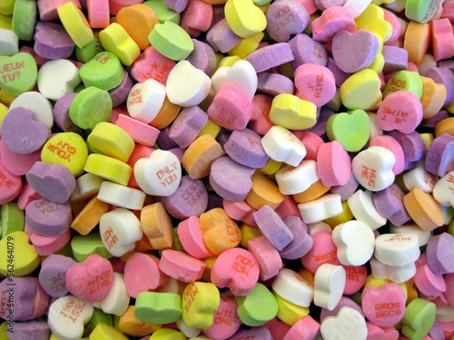 Фотография Sweethearts: background of candy hearts with messages on them.