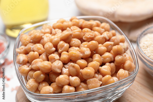 Delicious chickpeas on white table, closeup. Hummus ingredients