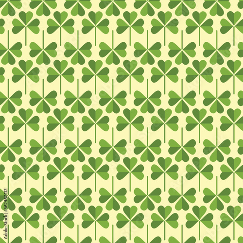Saint Patrick's Day greetings with tree leaf clovers on green background.