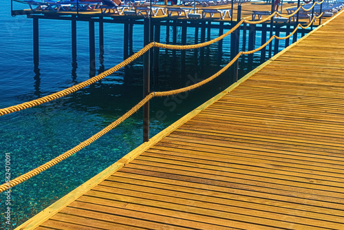 View of the wooden floor of the jetty and the blue sea in Kemer. Turkey