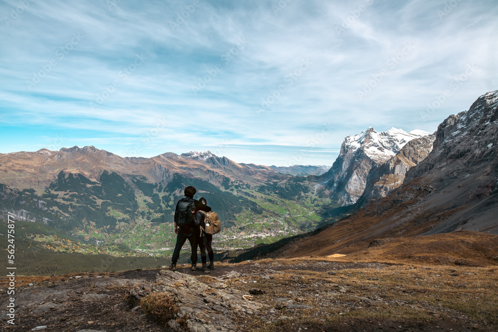 Couple overlooking mountains in the alps