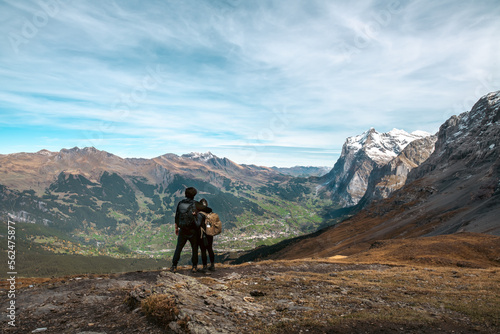 Couple overlooking mountains in the alps © Alexander