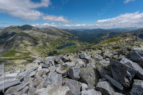 wide view of tna mountains in romania with lake in valley in carpathians in retezat mountains in romania