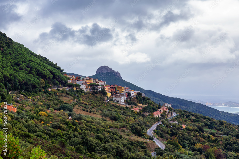 Fototapeta premium Small Touristic Town, Baunei, in the Mountains of Sardinia, Italy. Cloudy Rainy Day. Fall Season