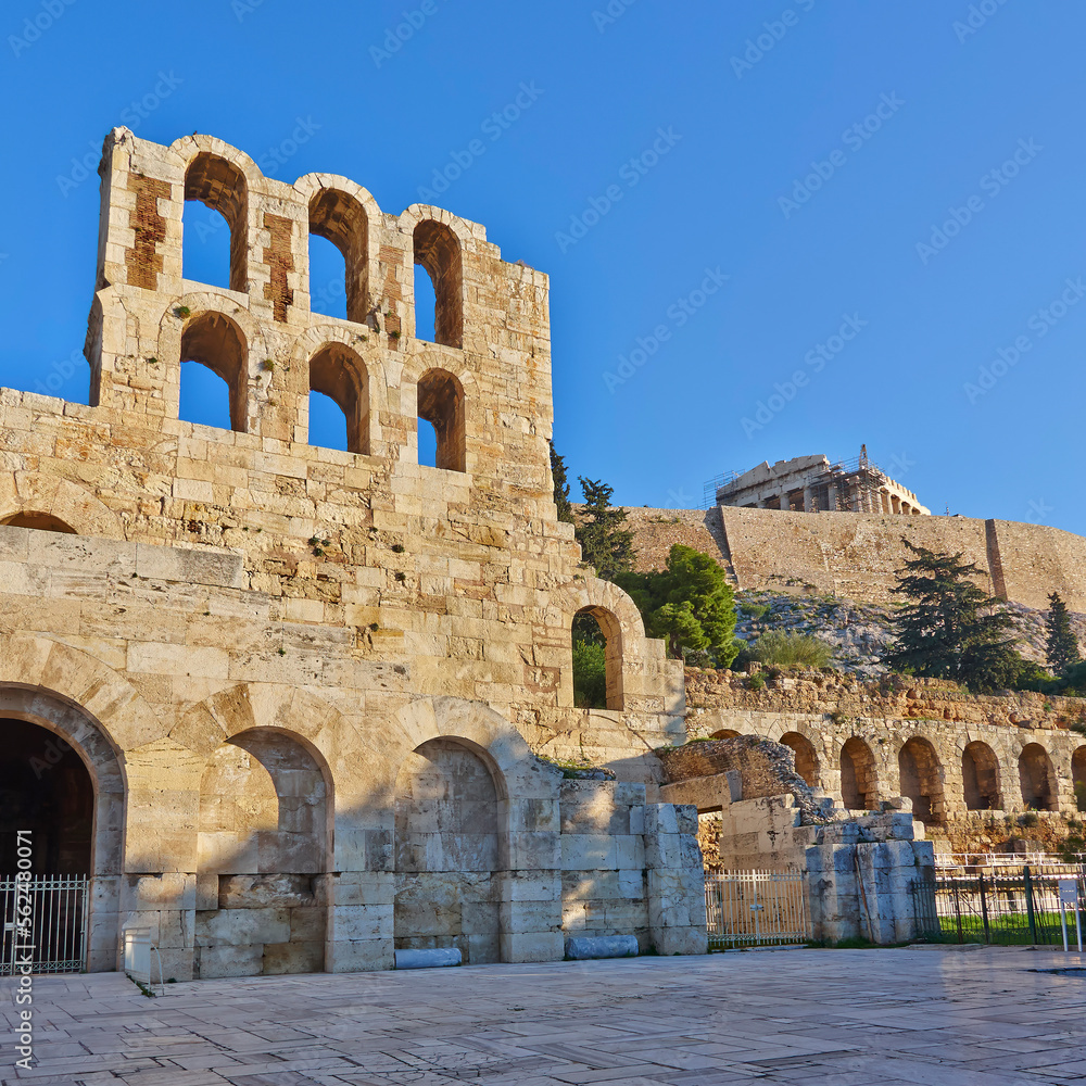 The entrance and arches of the ancient conservatory of Herod Atticus at the foot of the Acropolis. Cultural travel in Athens, Greece.