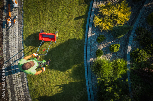Fotografija Seeding Spreader Used by Professional Gardener