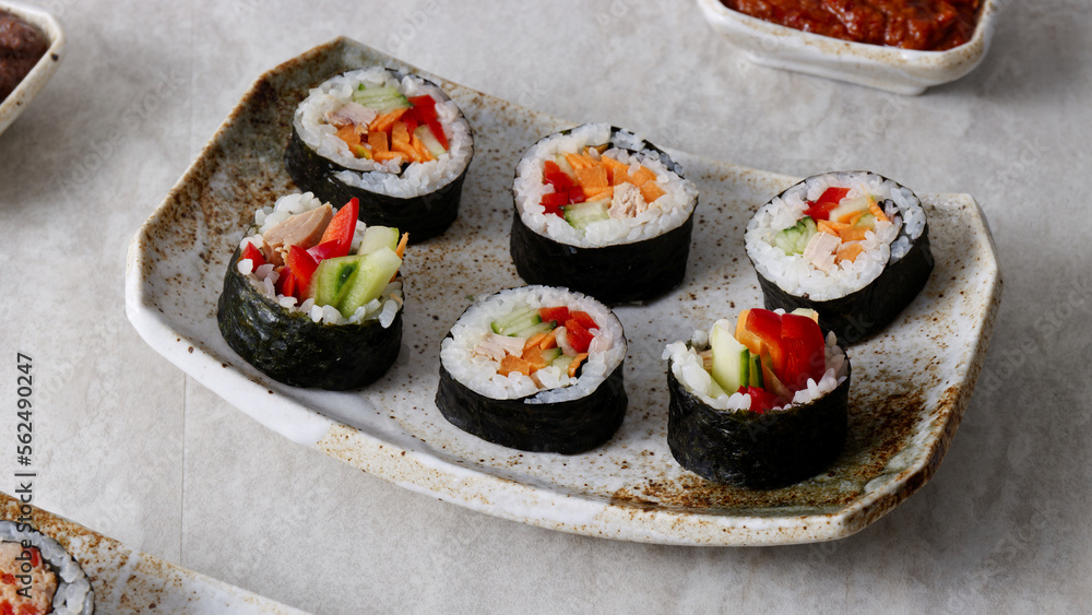 Homemade futomaki sushi rolls with vegetables and canned tuna fish. Homemade futomaki sushi rolls with vegetables and canned tuna fish.