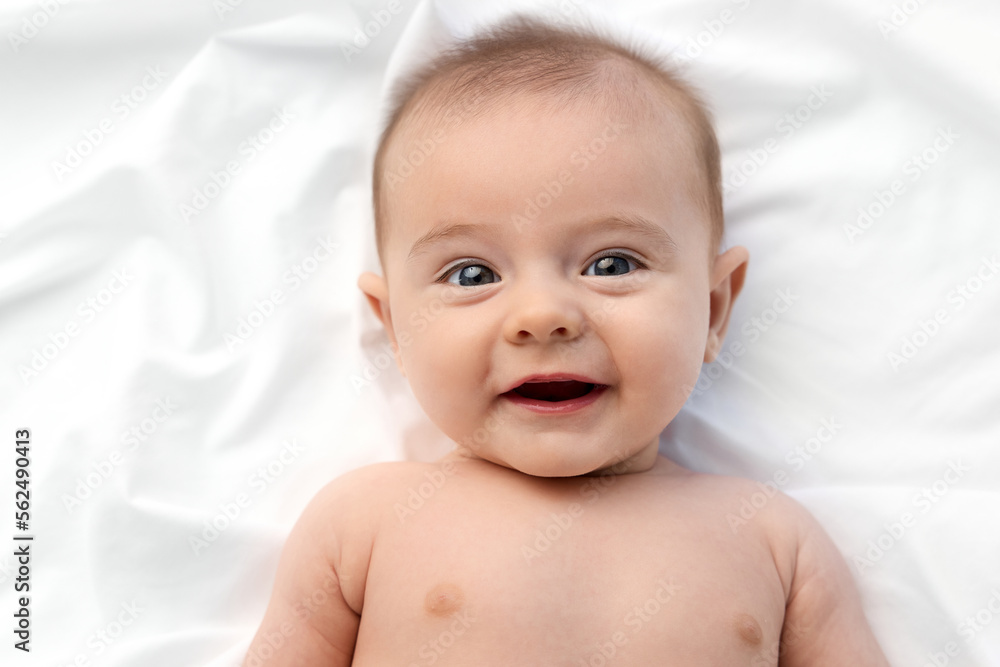 Portrait of smiling blue-eyed newborn baby Portrait of smiling blue-eyed newborn baby